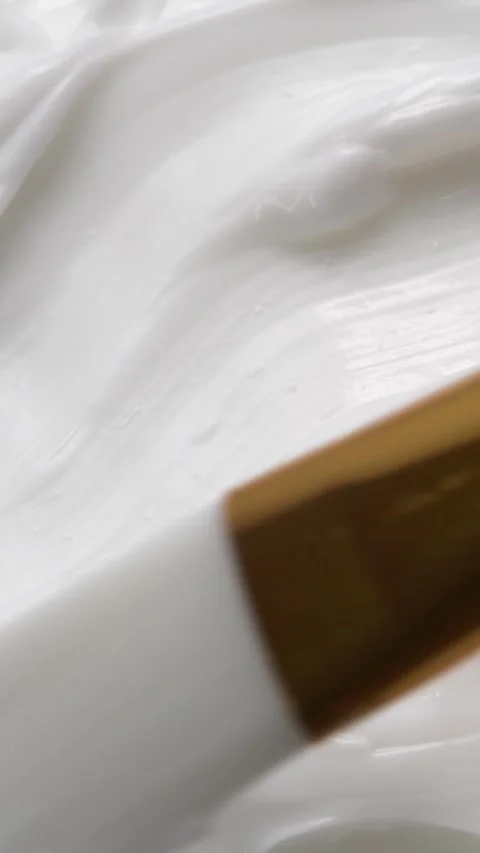 Vertical close-up white smooth skin cream texture, beauty facial cosmetics mask Vídeo Stock 287685441