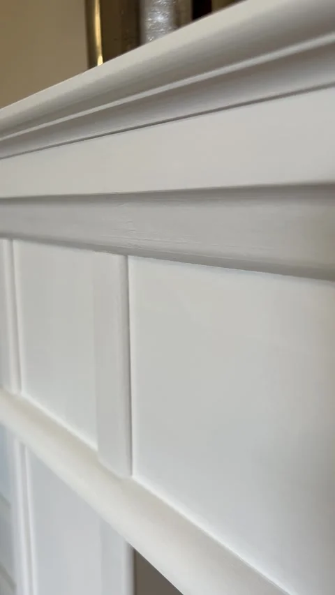 Vertical close-up to wide view of handcrafted white wooden fireplace mantle Video stock 342953801