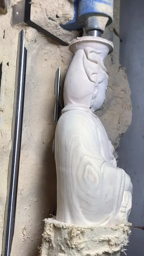 Vertical Close-up of Wood Carving Process of Guanyin Buddha Statue on Machin Stock Footage 326120483