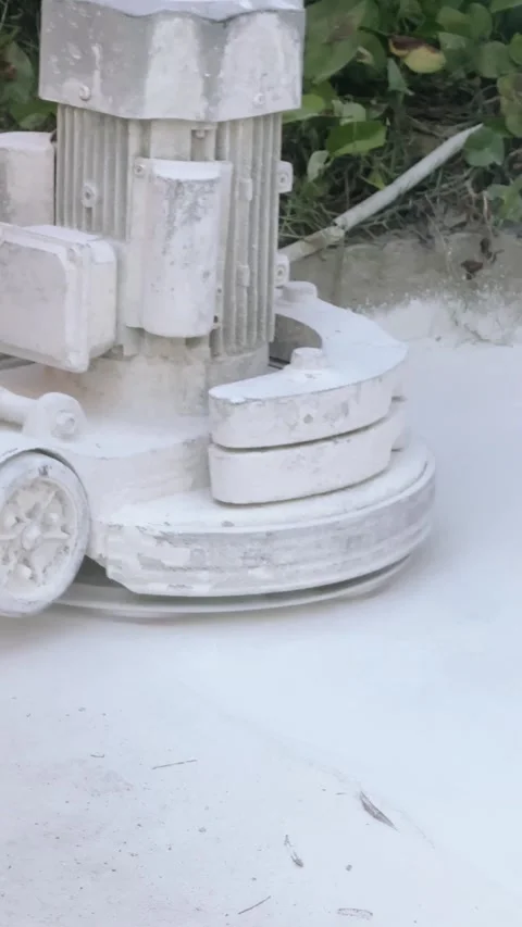 Vertical close up working concrete grinder machine covered in dust while Vidéo 343042451