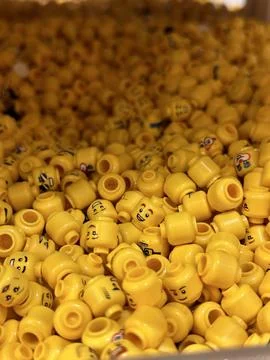 Vertical close up of yellow constructor doll toy heads Stock Photos