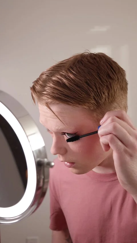 A Vertical Close-up of a Young Man Applying Mascara Makeup Routine Beauty Stock Footage 310221117