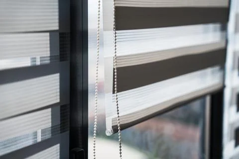 Vertical Close-Up of Zebra Window Blinds With Chain Control Foto stock