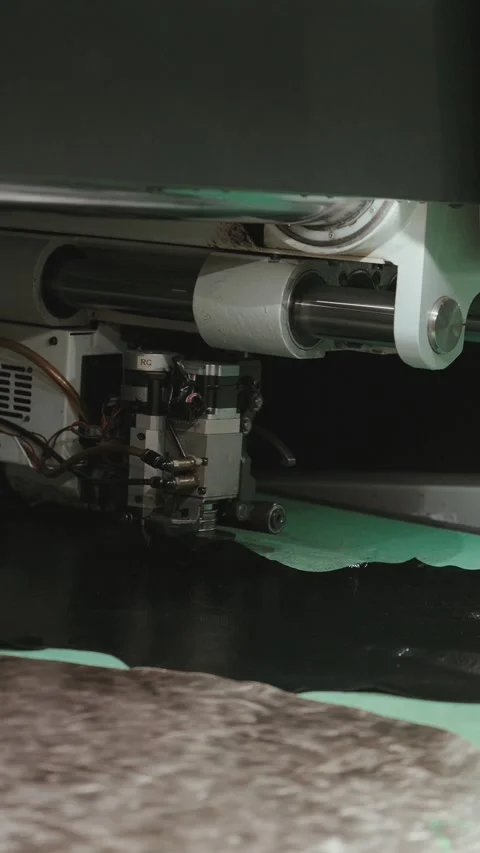 Vertical closeup of CNC cutting machine processing leather in factory Stock Footage 321589419