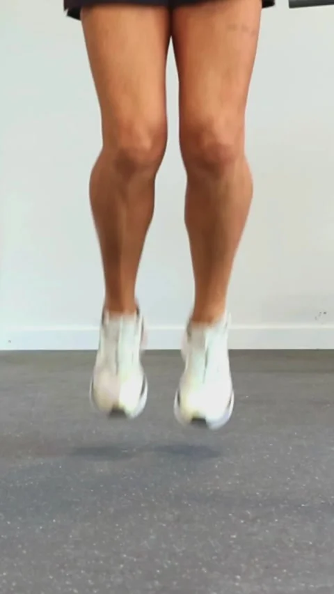 Vertical Closeup of elderly athletes legs jumping rope during cardiovascula.. Stock Footage 285092424