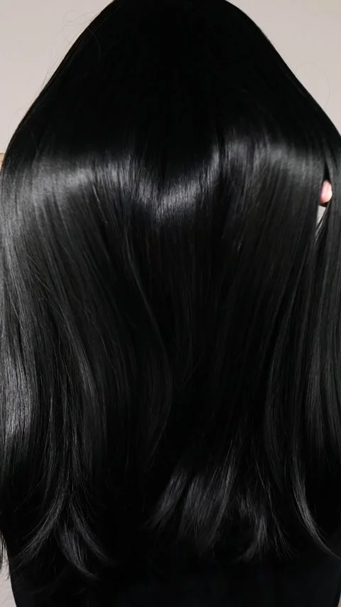 Vertical closeup of human female long black straight hair Video stock 277447617