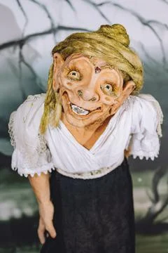 Vertical closeup of a modeled old witch that stole children in old legends Stock Photos