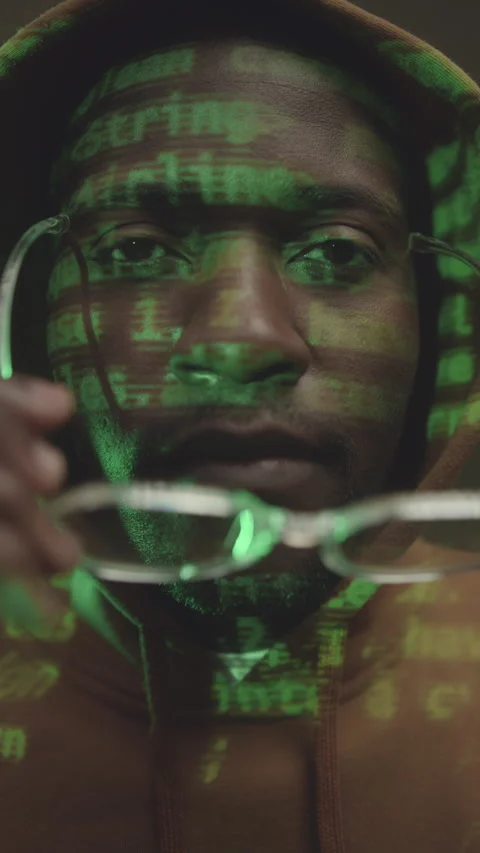 Vertical Closeup of Programmer with Code on His Face Stock Footage 259936566