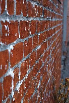 Vertical closeup of red brick wall pattern. Selected focus. Stock Photos