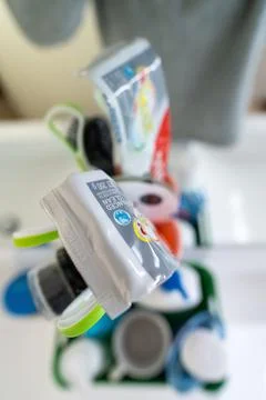 Vertical closeup shot of the end of a toothpaste bottle in a bathroom Stock Photos