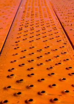 Vertical closeup shot of a textured bumpy orange surface 스톡 사진