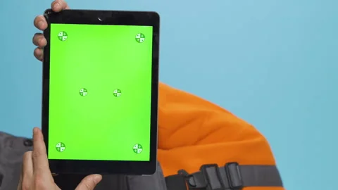 Vertical closeup shot using tablet computer with green mockup screen. Stock Footage 232493305