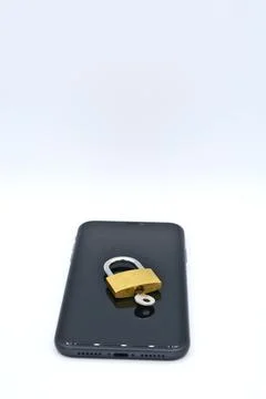 Vertical closeup of a smartphone with a lock on it on a white background for des 写真素材