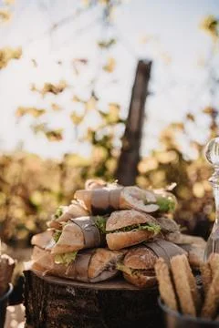 Vertical closeup of a stack of sandwiches on the dinner table. 스톡 사진