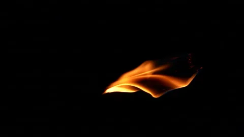 Vertical closeup torch fire flame burning over black background in slow motion Stock Footage 251699075