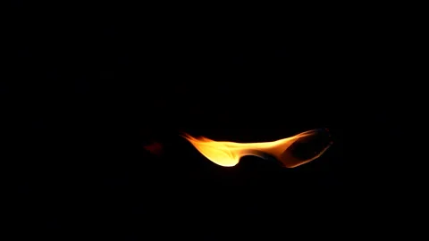 Vertical closeup torch fire flame burning over black background in slow motion Видео 255265370