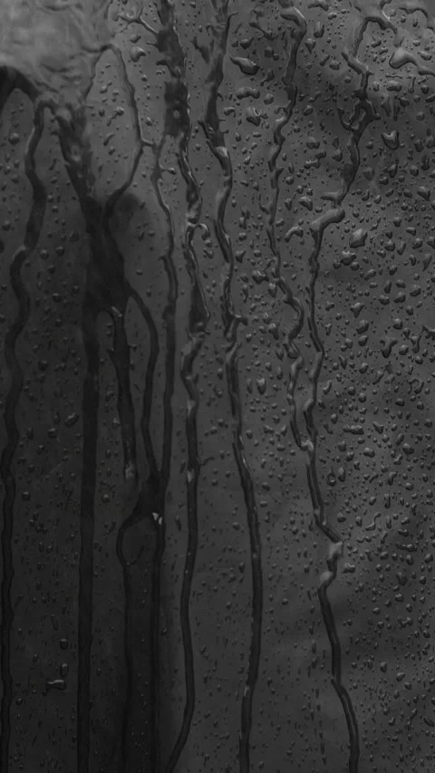 Vertical closeup video of black waterproof fabric in heavy rain with water drops Stock Footage 269878043