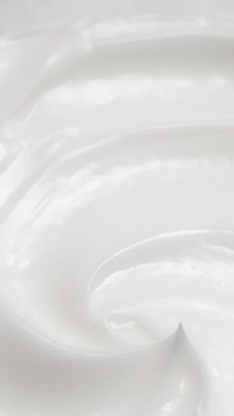 Vertical closeup white eye, skin cream texture background, facial cosmetics mask Stock Footage 312660293