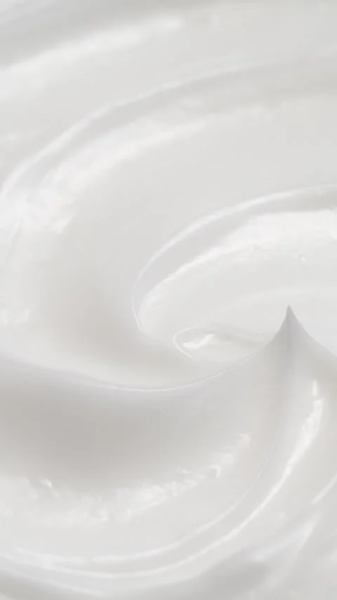 Vertical closeup white eye, skin cream texture background, facial cosmetics mask Stock Footage 314696512