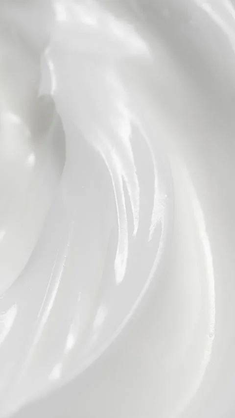 Vertical closeup white eye, skin cream texture background, facial cosmetics mask Stock Footage 315735685