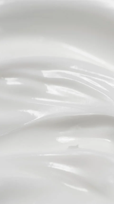 Vertical closeup white eye, skin cream texture background, facial cosmetics mask Stock Footage 316875191