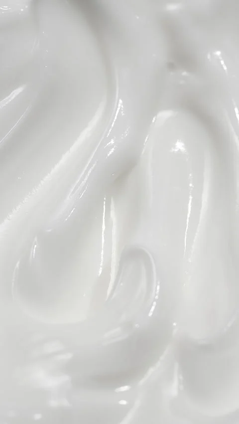 Vertical closeup white eye, skin cream texture background, facial cosmetics mask Stock Footage 317367165