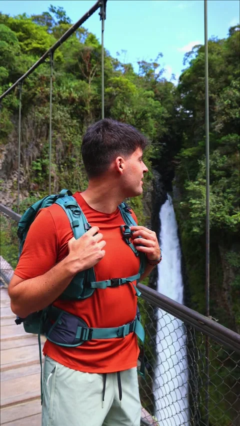 Vertical Closeup of young adventurer with backpack observing Pailn del Diab.. Stock Footage 280338490