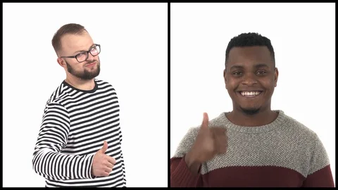 Vertical collage of two young and handsome multiracial men showing thumbs up. 스톡 동영상 129568215