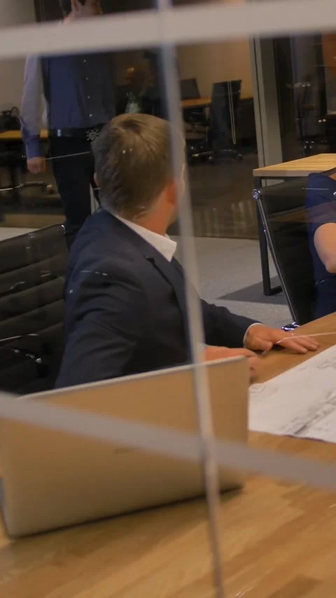 Vertical of Colleagues at the table look the drawing paper and talking Stock Footage 277278837