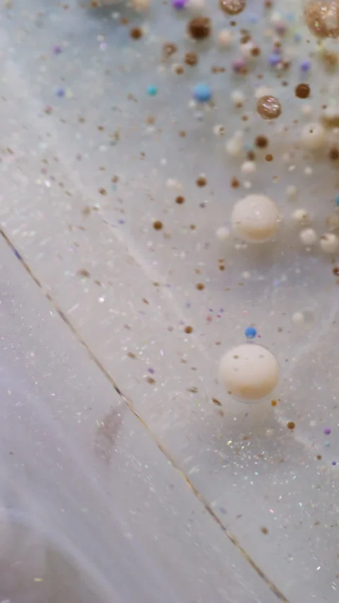 Vertical colorful fluid bubble paint swirl flow Stock Footage 315958749