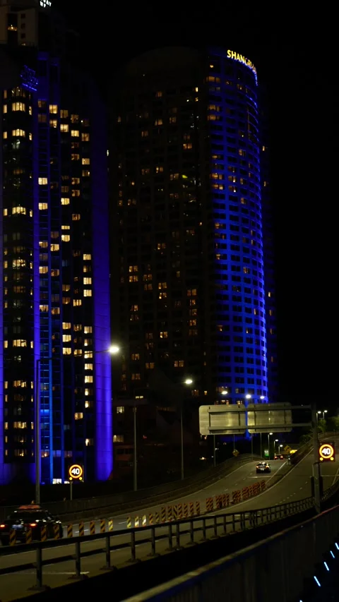 Vertical colours change on two Sydney buildings during VIVID 6K Stock Footage 310397843