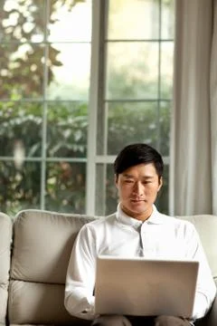 Vertical composition Contact Sitting Communication Oriental figures Window a man Stock Photos