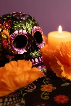 A vertical composition featuring a skull decorated with metallic flowers, f.. Stock Photos