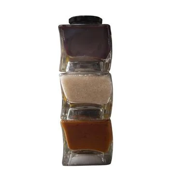 Vertical composition of spice glass containers on a white background Stock Photos