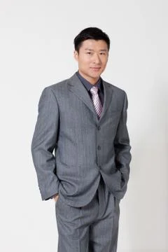 Vertical composition Standing. Professional attire Suit Business people Staff Stock Photos