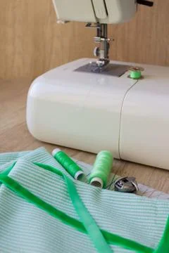 Vertical composition with threads sewing machine and sewing accessories and t Stock Photos