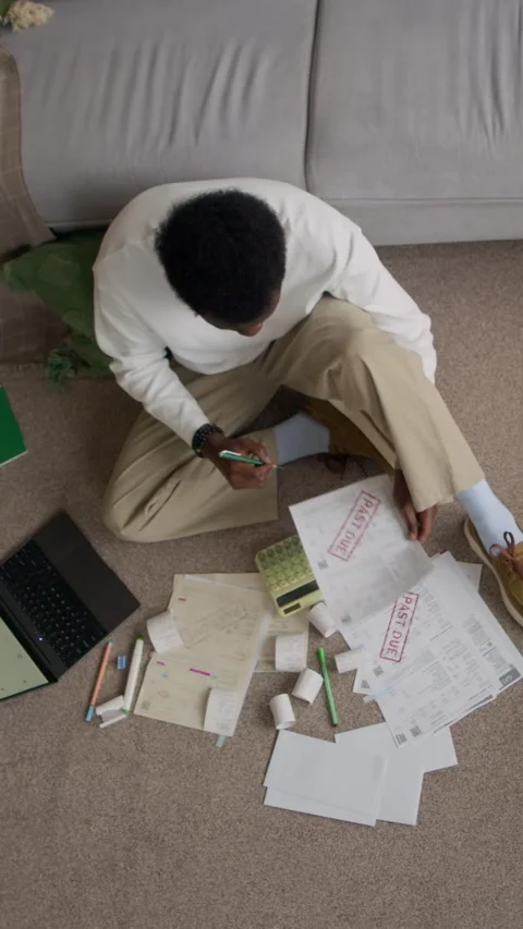 Vertical of Concerned Man Managing Household Expenses on Living Room Floor Vídeos de archivo 321860764