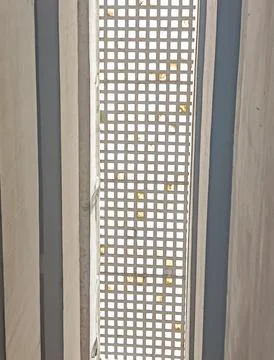 Vertical Concrete Breeze Block Screen with Geometric Grid Pattern Stock Photos