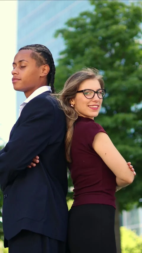 Vertical Confident multicultural business partners standing back to back in.. Stock Footage 317014408