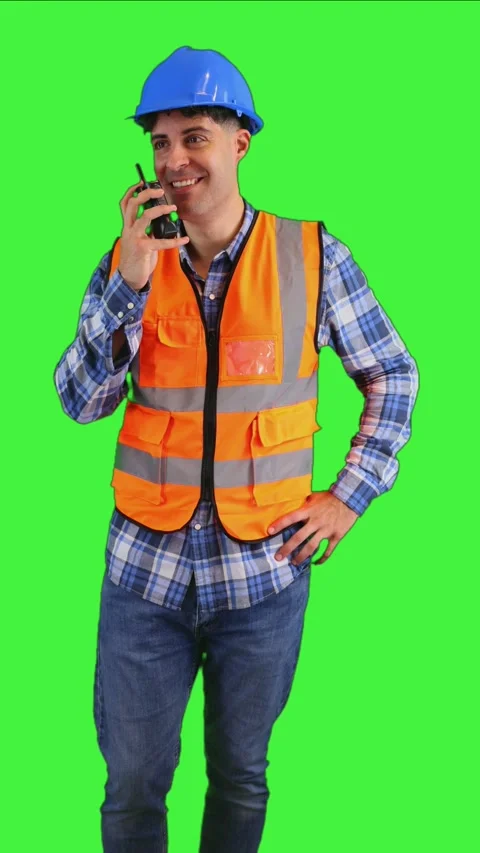 Vertical Construction worker communicating through his walkie-talkie chroma k Stock Footage 287328010