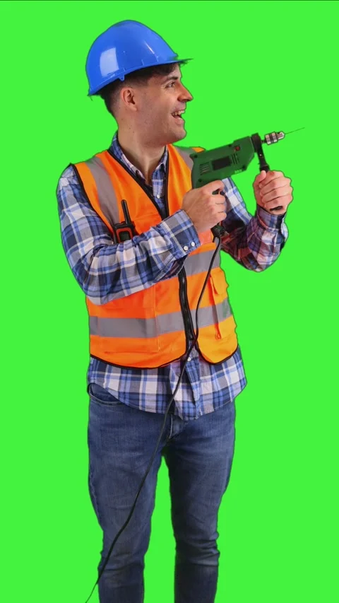 Vertical Construction worker drilling into a wall wearing orange vest and s.. Stock Footage 287327982