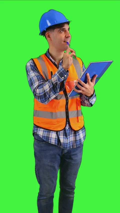 Vertical Construction worker taking notes in notebook with pen wearing oran.. Stock Footage 287328052