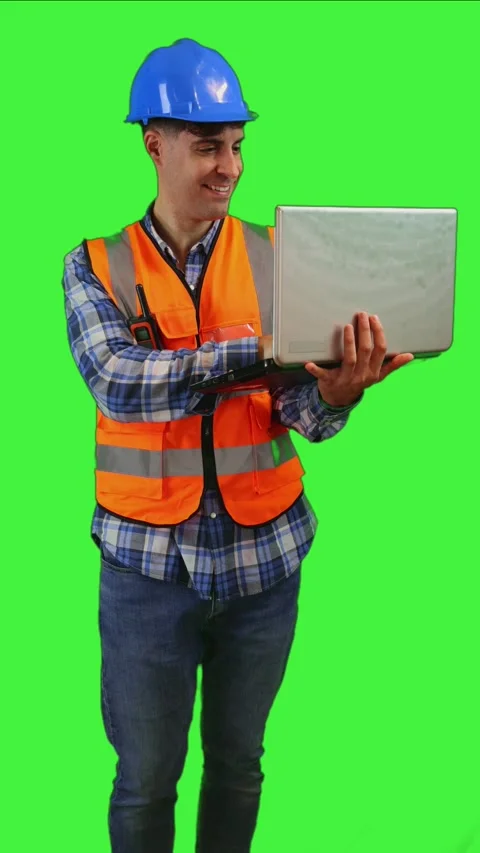 Vertical Construction worker working on laptop sending emails, wearing oran.. Stock Footage 287328049