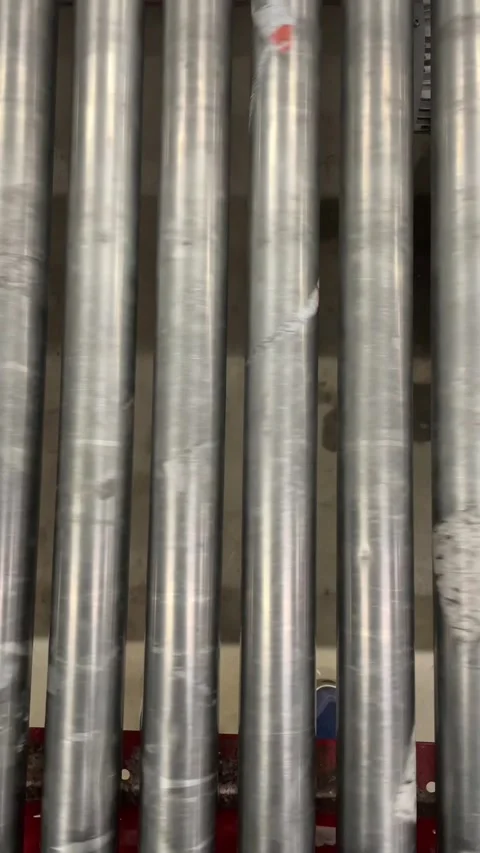 Vertical conveyor rollers arranged in repeating pattern for visuals Stock Footage 347334466