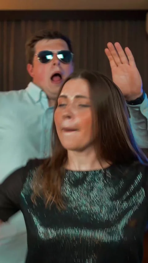 Vertical of Couple have funny dance at evening party Stock Footage 278482517