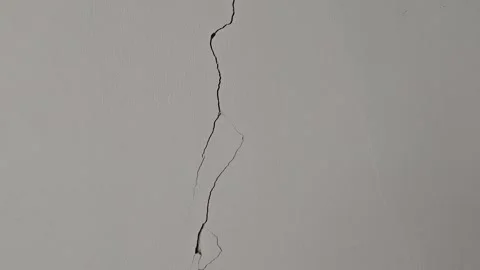 Vertical cracks in the cement wall textured background effect from earthquake Stock Footage 315727635