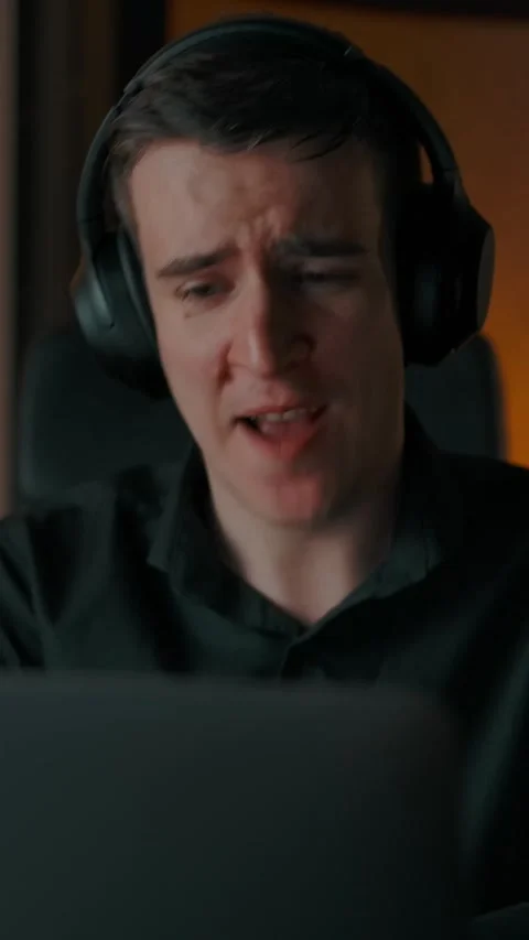 Vertical of Crazy man singing song in headphones indoor of cozy home interior Stock Footage 276932016