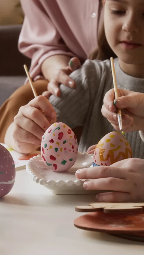 Vertical of Creative Girls Decorating Eggs with Gouache Paint for Easter Holiday 库存影片 327888987
