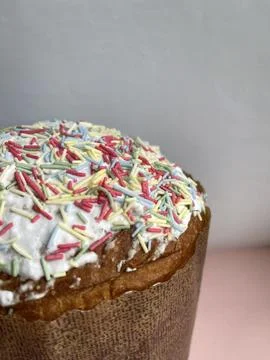 Vertical cropped shot of an easter cake with multi-colored sprinkles Stock Photos