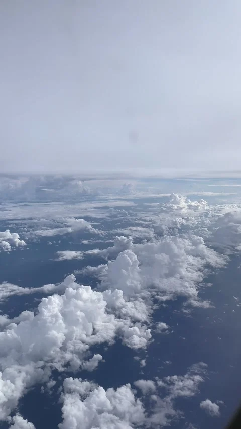 (Vertical) Cumulus Clouds Seen From an Airplane Window Near Hanoi Video stock 342590746